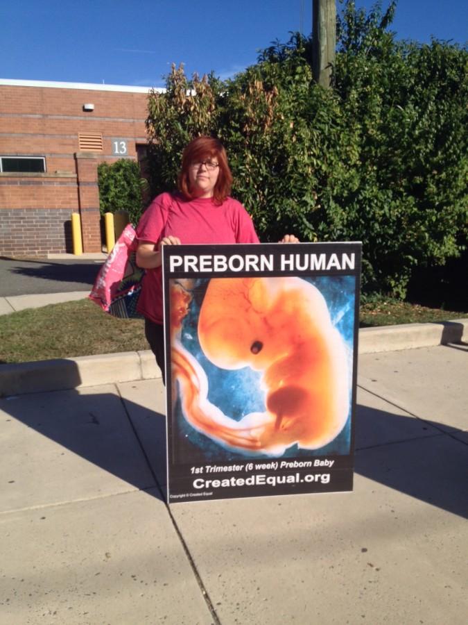 Activist Lauren Handy outside of the school building.