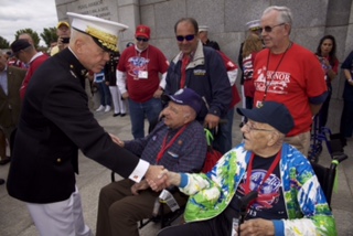 The 35th Commandant of the Marine Corps, Gen. James F. Amos, left, meets with World War II veterans during the Honor Flight event at the World War II Memorial  in Washington, D.C., Sept. 28, 2013. The Honor Flight Network, founded in 2005, flies WWII veterans free of charge to the Washington, D.C. memorial. (U.S. Marine Corps photo by Sgt. Mallory S. VanderSchans/Released)