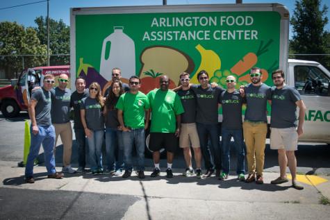 Volunteers and workers pose in front of the AFAC truck.