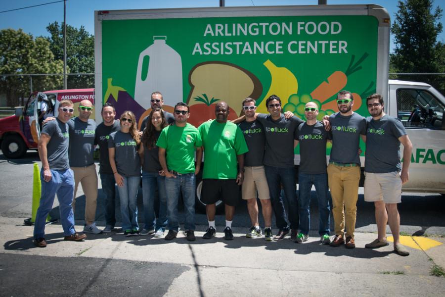 Volunteers and workers pose in front of the AFAC truck. 