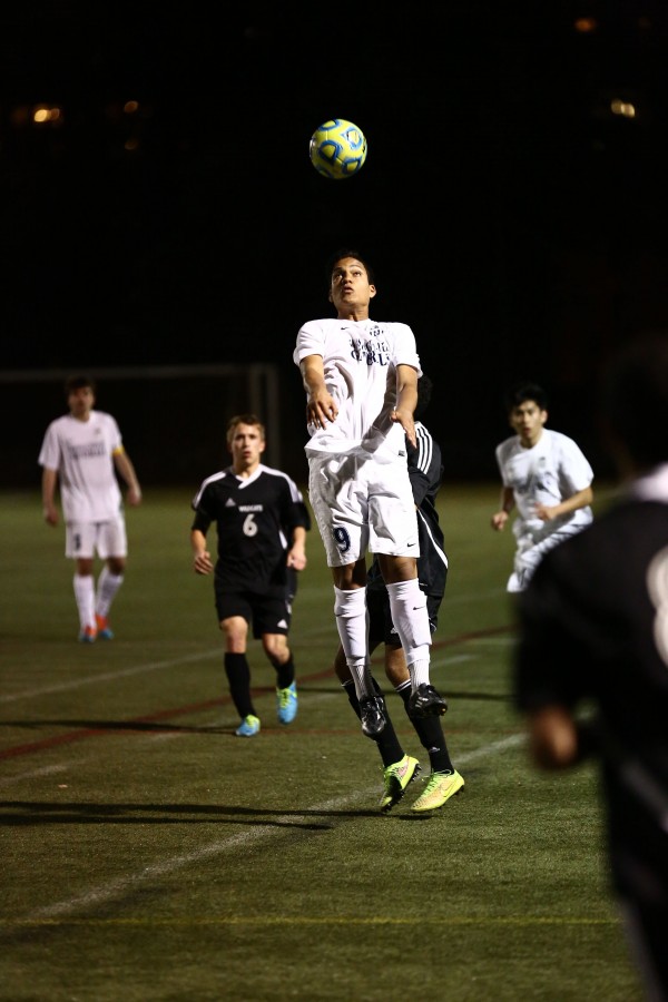 Junior Alejandro Maldonado-Romero heads the ball during a W-L soccer game.