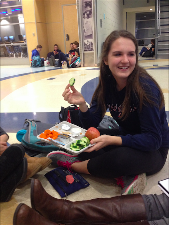Sophomore+Cara+Ford+enjoys+her+lunch+of+a+chicken+sandwich%2C+cucumbers%2C+an+apple+and+milk+while+talking+to+her+friends