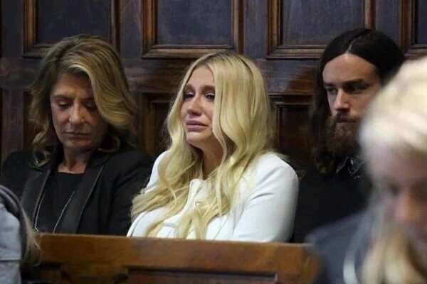 Singer and songwriter Kesha sits in the back of courtroom as Justice Shirley Kornreich rules against her.