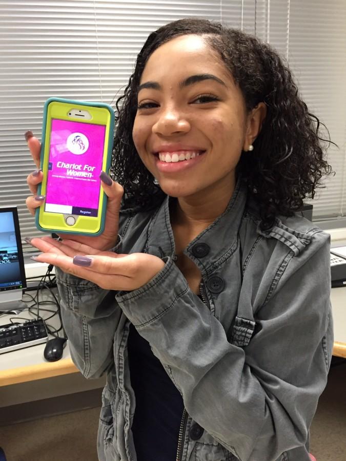 Senior Marisa Sydnor poses with the Chariot for Women app the day of the release. 