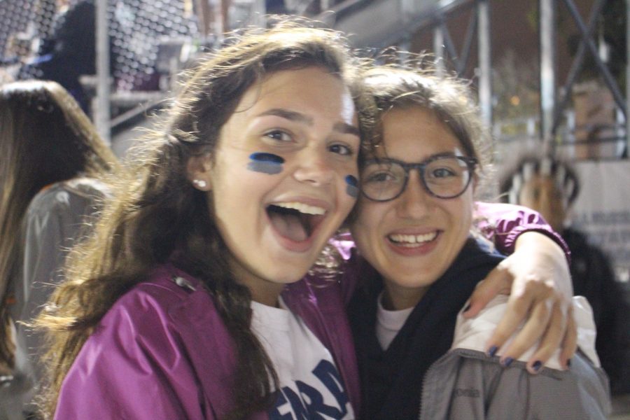 Two football fans at the homecoming game