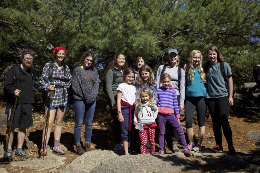 W-L students and the children of IB Philosophy teacher Mr. Summers pose at the top of Old Rag Mountain in Nethers, Virginia after a nearly four hour trek.