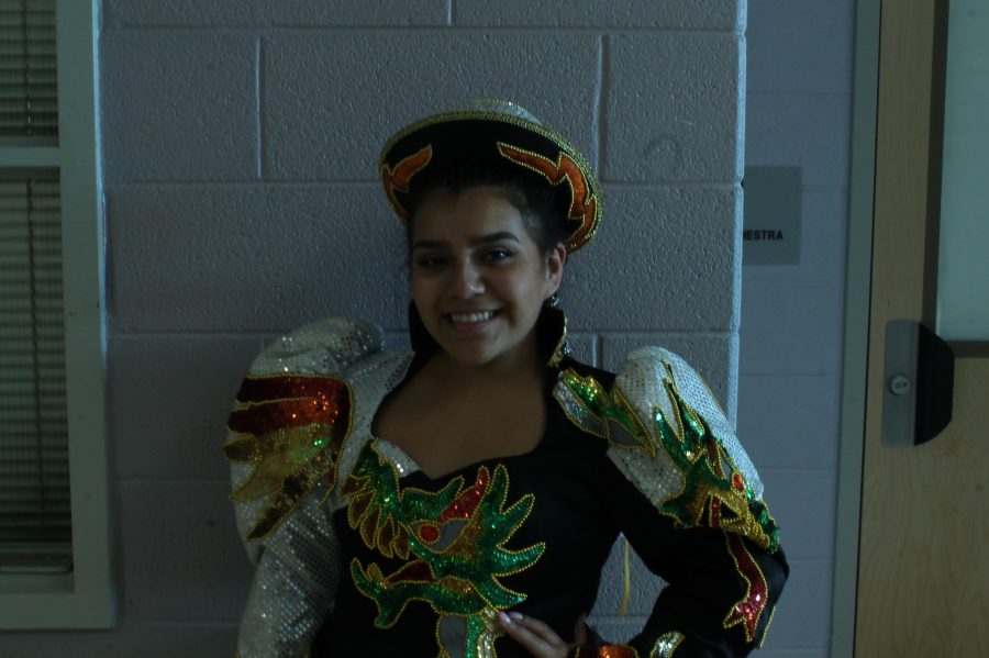 Junior Karen Torrico prepares for a traditional Bolivian dance. 