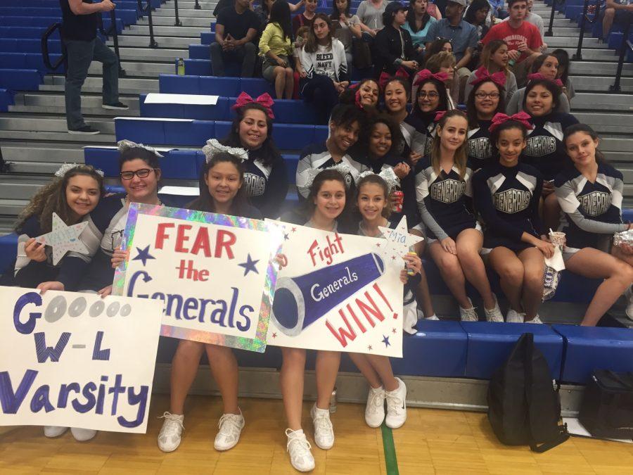 Freshmen and JV cheerleaders support varsity at Finals.
