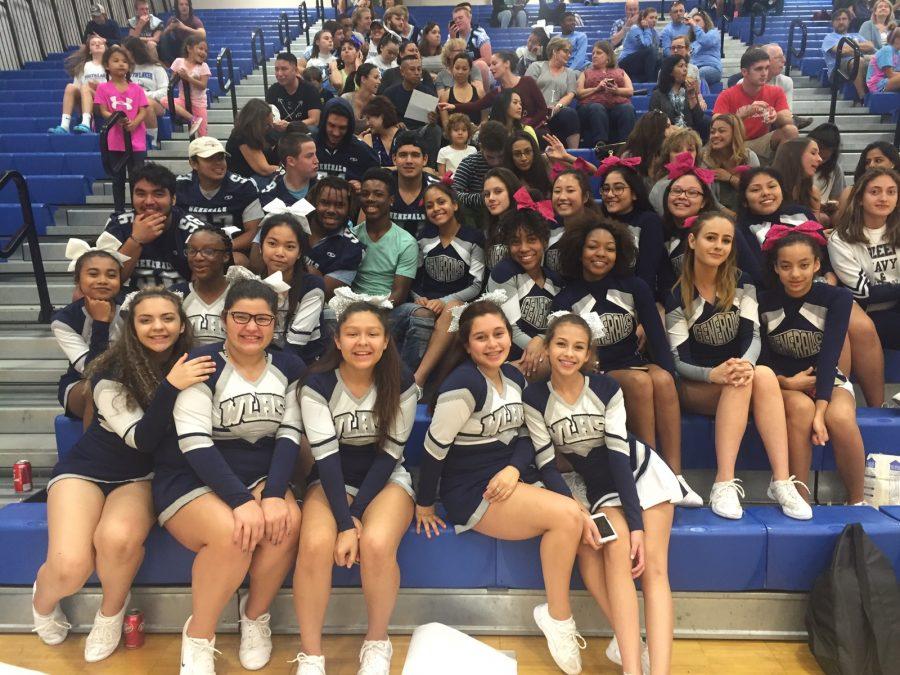 Varsity football players, along with freshmen and JV cheerleaders, support varsity cheer at Finals, which took place at South Lakes. 