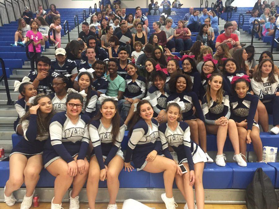 Varsity football players, along with freshmen and JV cheerleaders support varsity cheer at Finals which took place at South Lakes. 