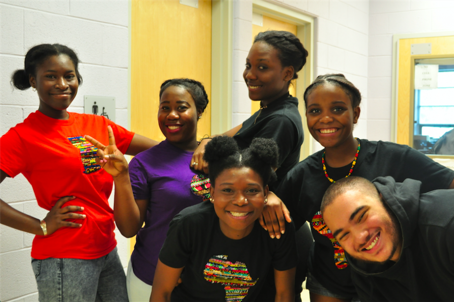 The seniors, juniors and sophomores of the World Dance Club celebrate after a successful performance.