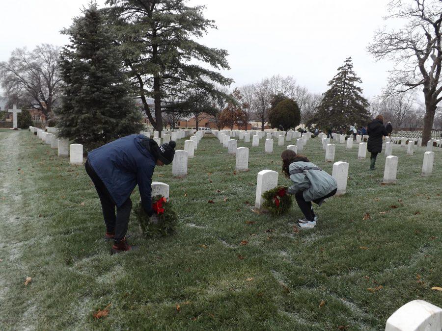 Seniors Claire Huggins and Ethan Hall lay wreaths at Arlington National Cemetery. 