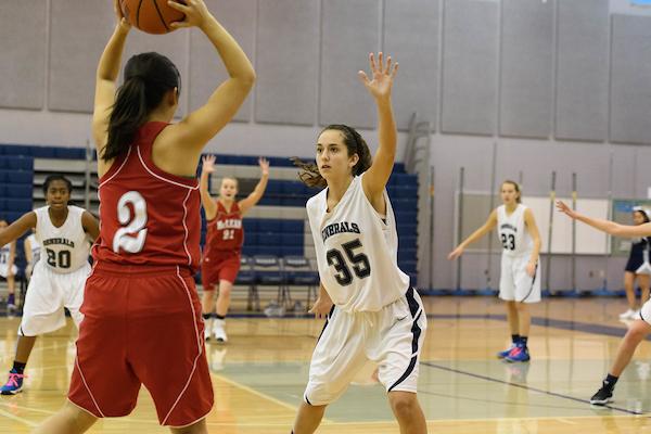 JV girls basketball demonstrates defensive tactics. 