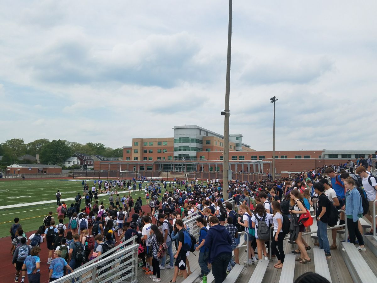 Students exit the bleachers after seniors win the SCA Olympics.