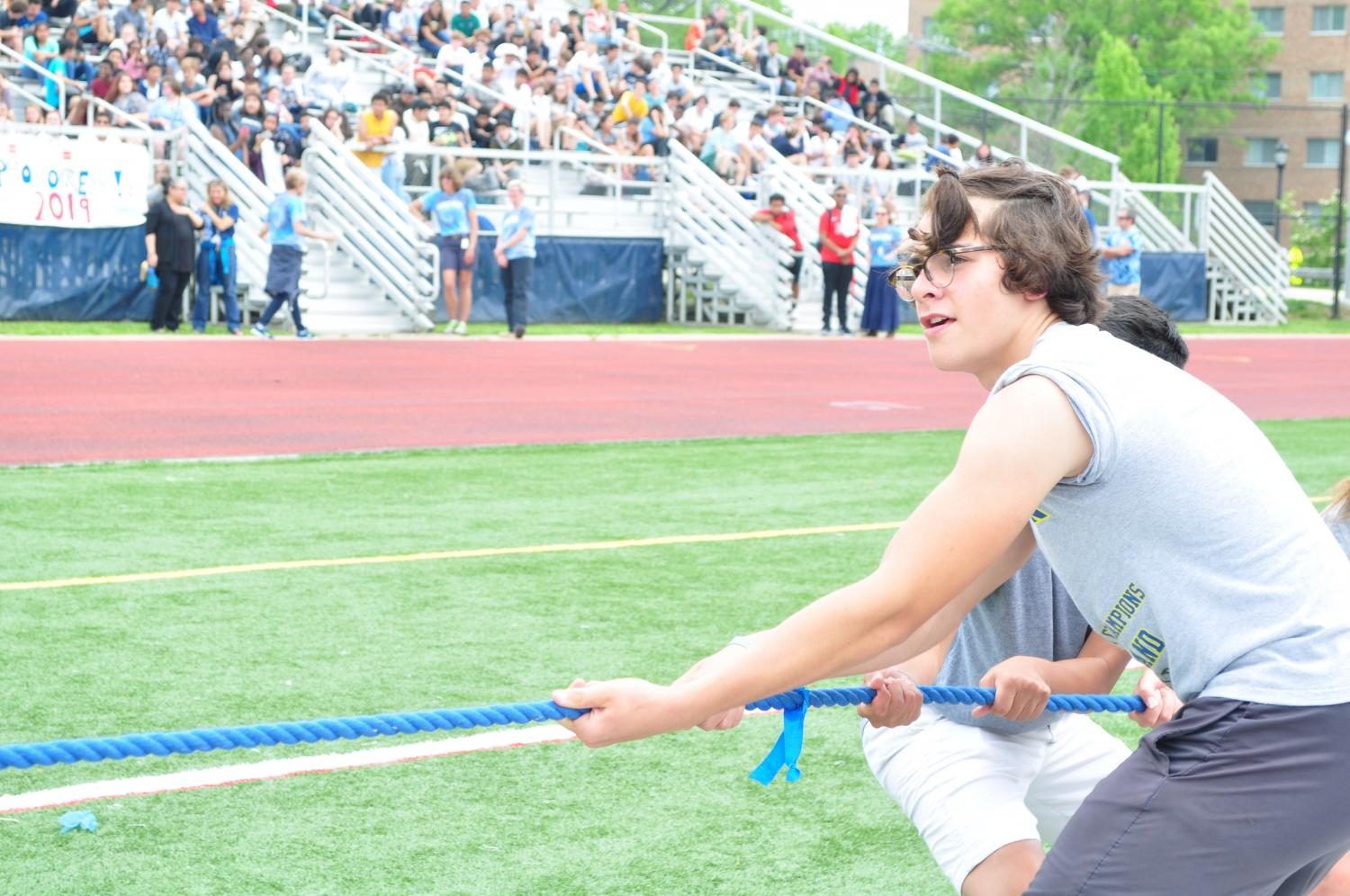 Freshman Noah Toth tries to edge the seniors out for a win in the tug-of-war event.