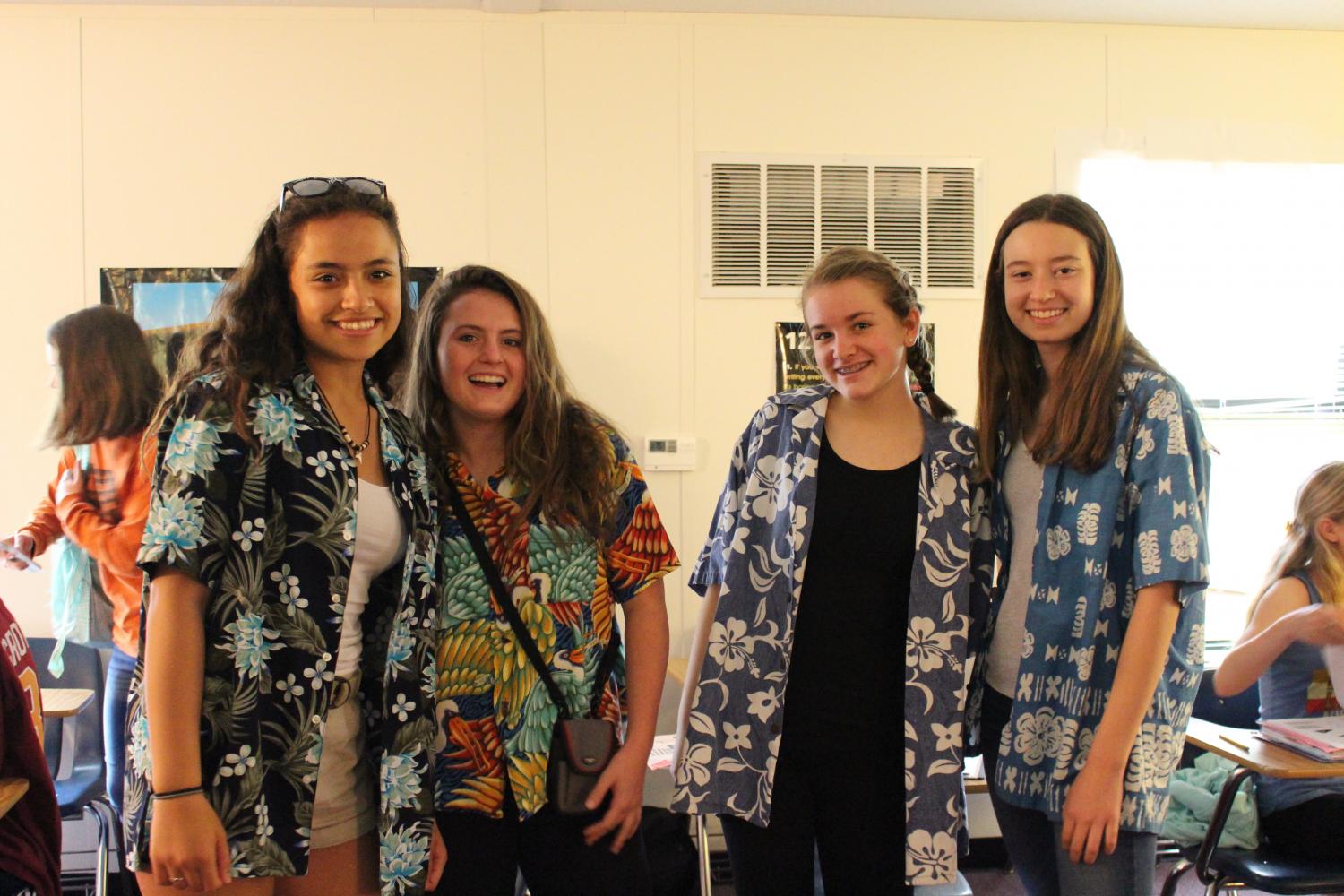 Freshmen Chloe Slater, Darsey Trudo, Camilla Regalia and Caroline Chappell show their school spirit on Tourist Tuesday.