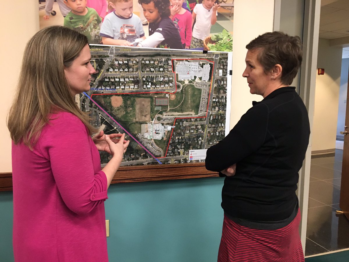 Assistant Superintendent of Instruction Dr. Tara Nattrass discusses one of Arlington Public Schools expansion plans with a parent.