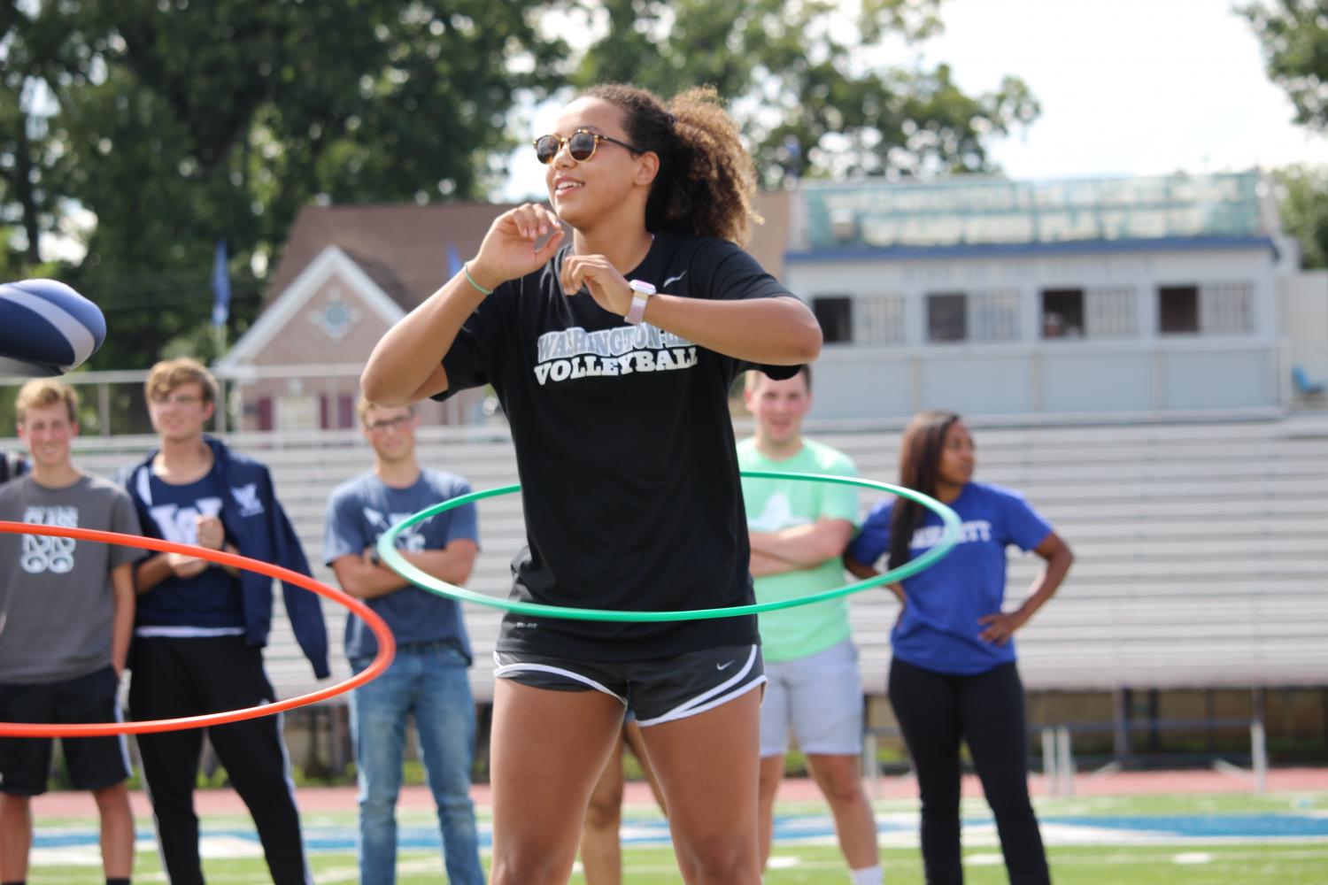 Senior Leonie Adler competes in the hula hoop competition for the schools varsity volleyball team.