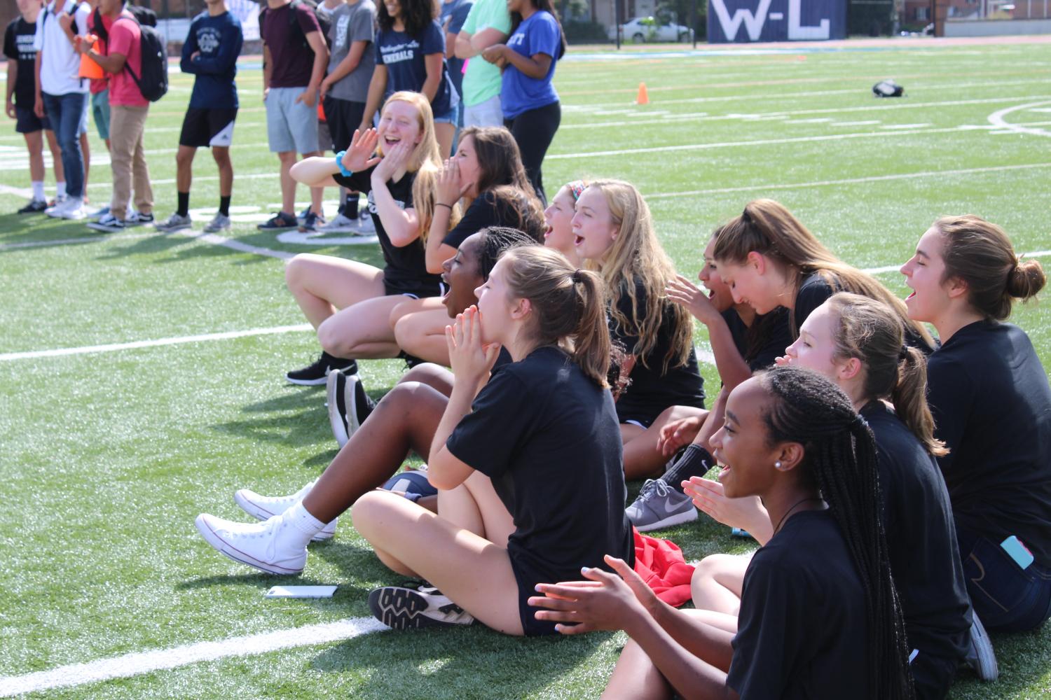 The SCA members of the junior class cheer on their representative in the hula-hoop competition