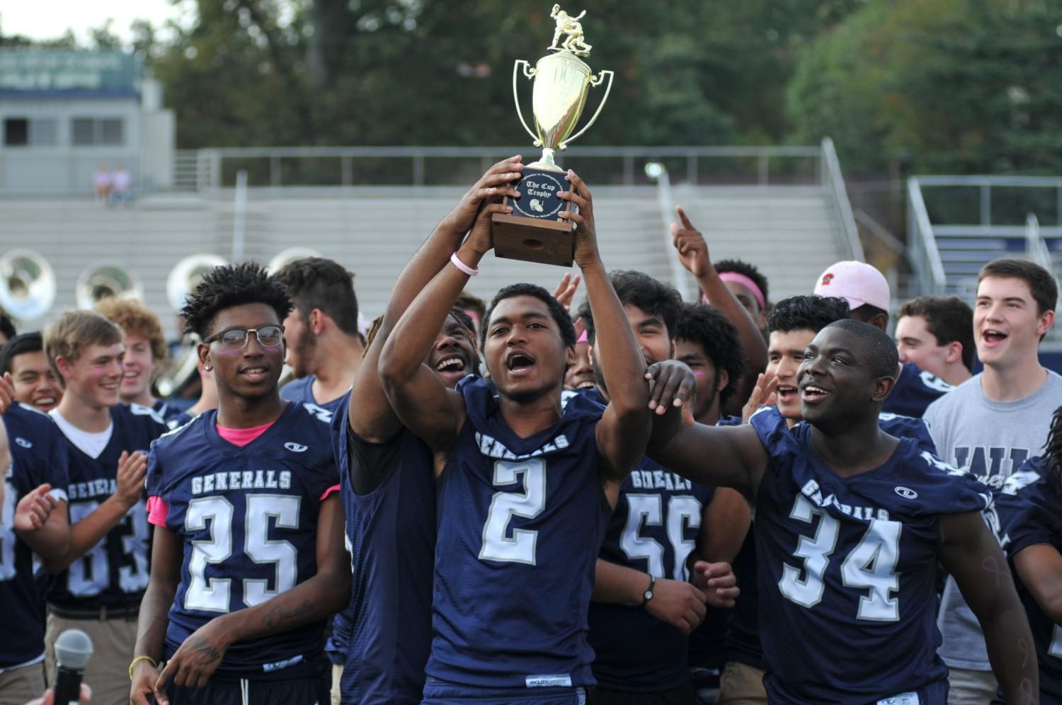 The varsity football team gets the school pumped for the Homecoming game at the 2016-17 pep rally.