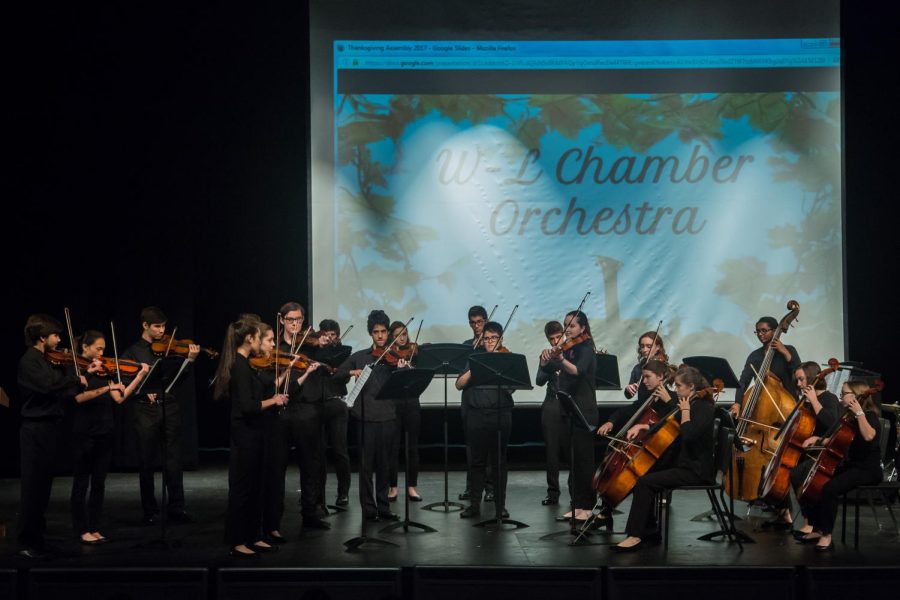 Members of the chamber orchestra perform at this years Thanksgiving assembly. The annual performance is organized by the Student Council Association (SCA).