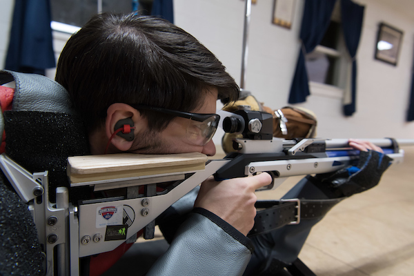 The rifle team has been working hard all year,  perfecting their shots. Senior Aaron Tinter takes aim for a target during practice.  