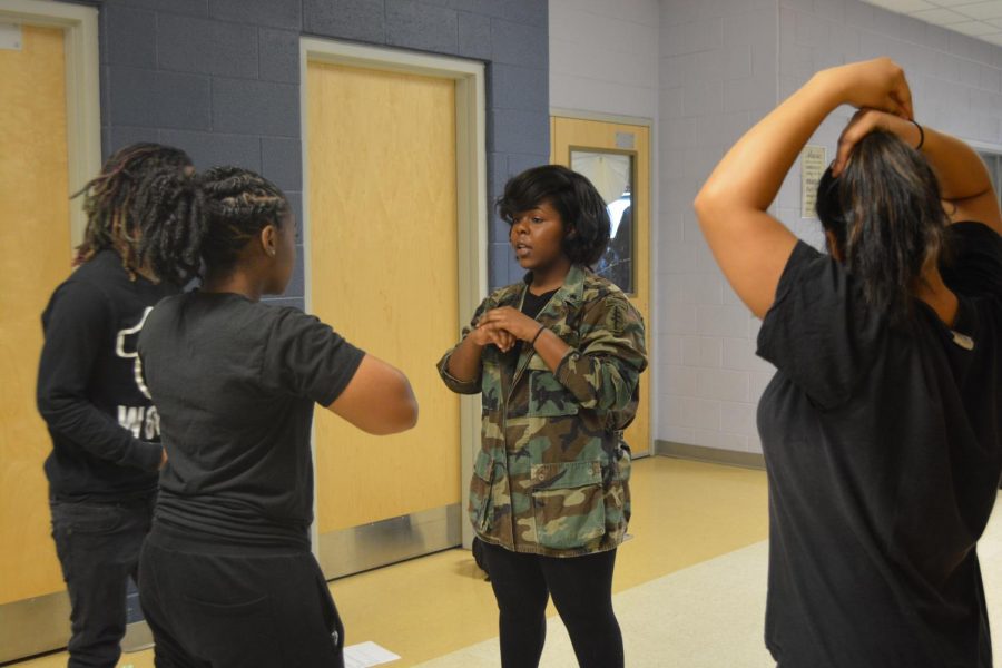 Williams and her step crew practice before the assembly. 