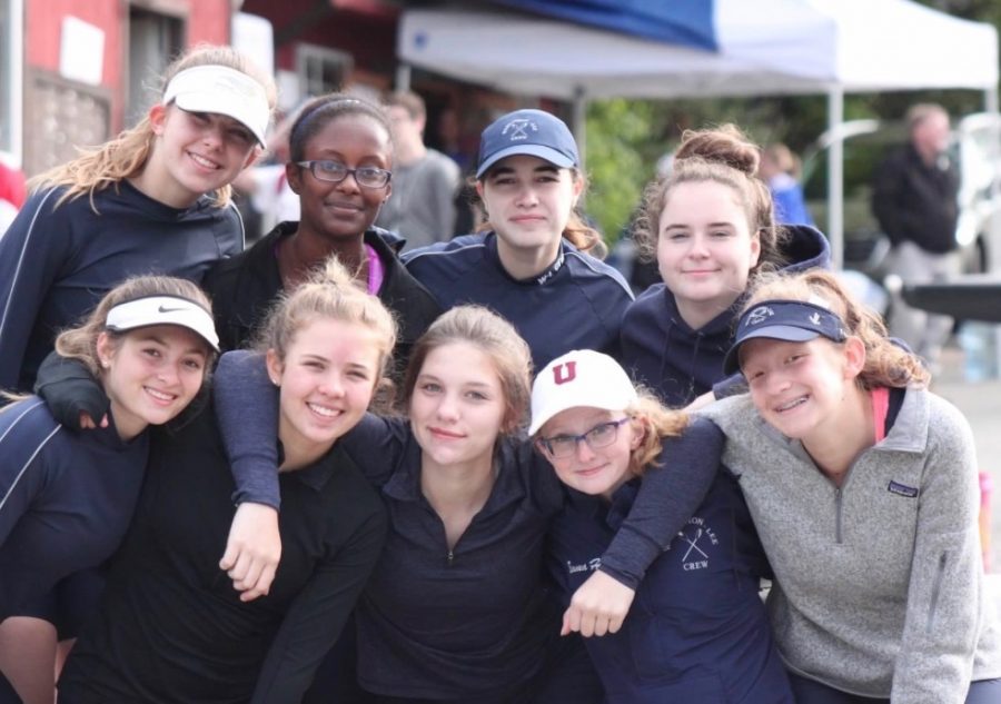 The 2017 girls crew team poses for a picture at the team docks in Georgetown. 