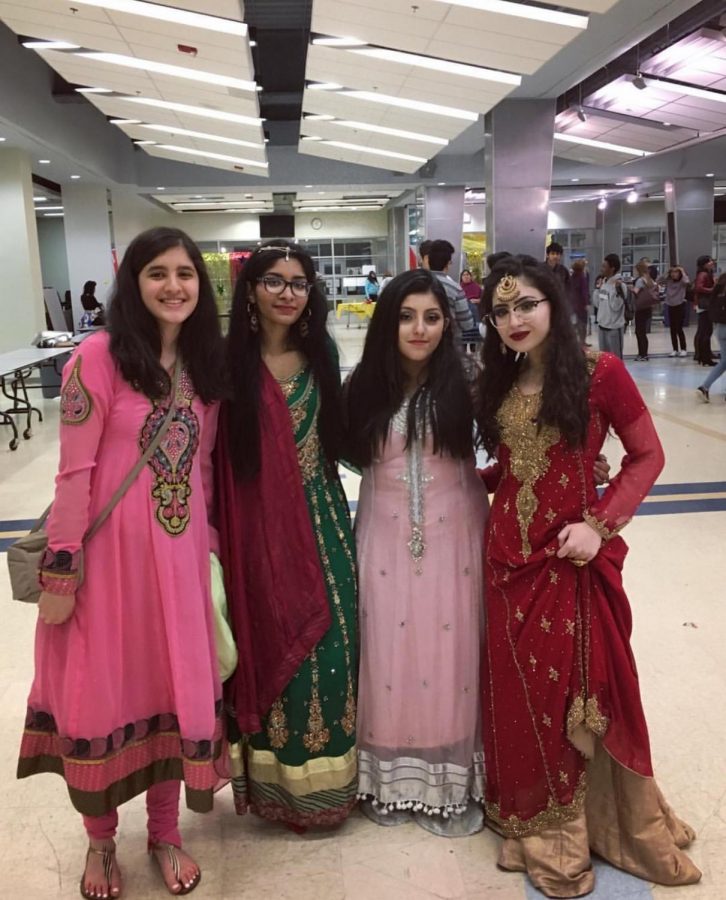 International Clubs co-president Sabbah Mughal and past members pose at last years International Night event.