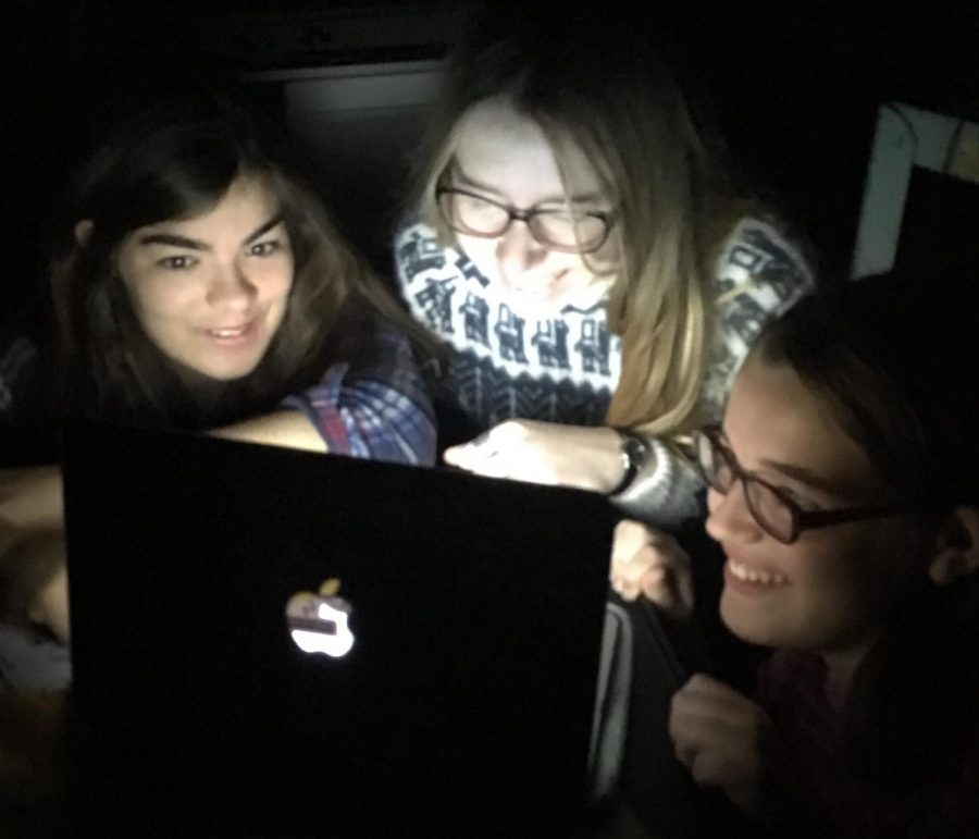 Students huddle around a computer screen to get their horror fix before Halloween. Teenagers have long been a key demographic of horror movie watchers.