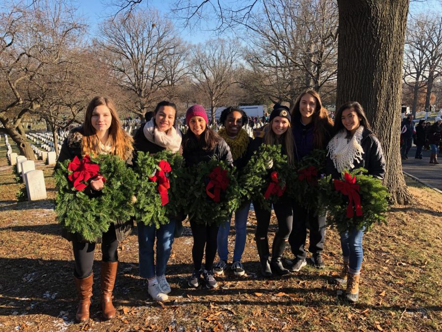 Action team members stand proudly in front of the Arlington National Cemetery, just after laying wreaths on the gravestones. Action Team hopes to complete many more service activities for future holiday seasons. 