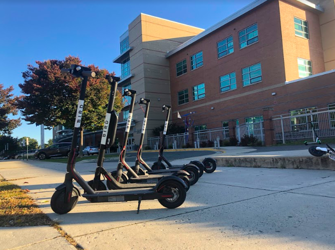 A collection of Bird scooters reside outside of the school, dropped off by students after the morning bell. Many of the students at the school use the scooters as a ride to school and back home everyday.