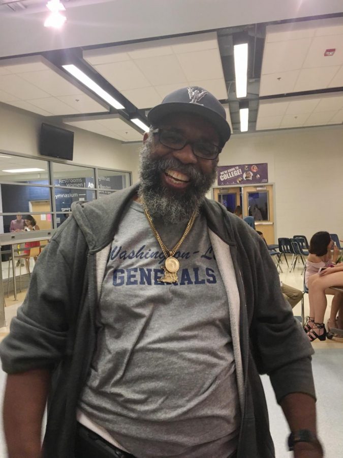 Mr.+Glenroy+joining+in+the+fun+at+the+Homecoming+Dance+of+2018.+Though+he+works+all+day+at+the+school%2C+he+still+finds+time+to+help+out+the+students+after+school+hours.