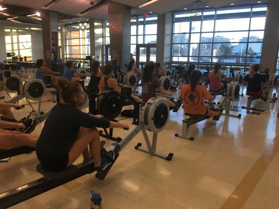 Hard at work, the girls crew team practices rowing on machines called ergometers. The crew team must raise close to 700 dollars per person in funds.