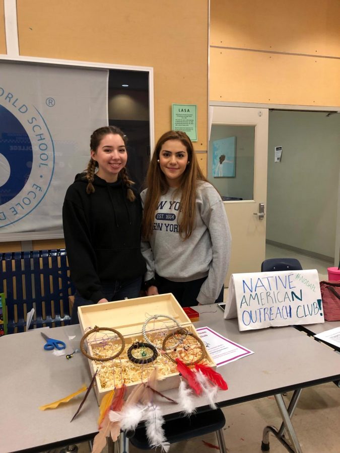 Lamara Allen and Ryah Aziz selling dream catchers they made in the Native American Outreach Club.