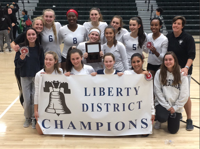 The girls volleyball team celebrates their district title at Langley High School. They won the Liberty District championship against Langley on October 25.