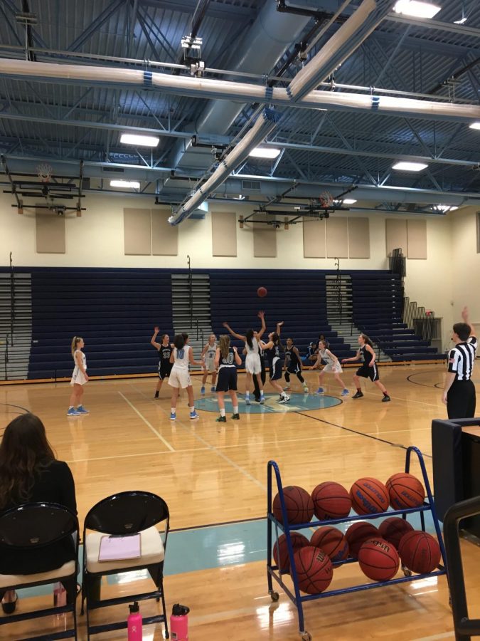 The freshmen teams prepare for the tip off as the ball is thrown in the air. The Generals won the toss. 