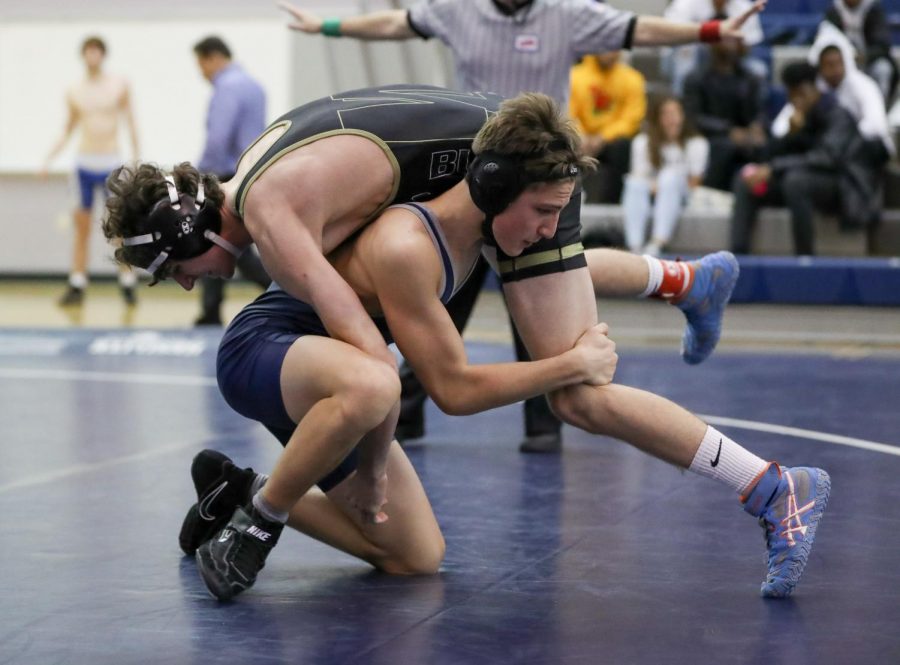 Freshman Noah Laidhold participates in a JV wrestling match.