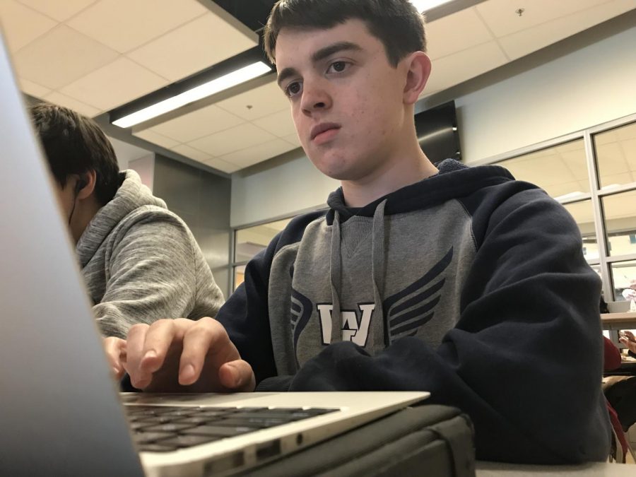 Senior Conor Clark checks his email, which is often filled with unopened messages from numerous colleges, which sometimes mislead students.