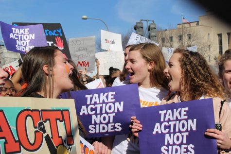 Juniors Darsey Trudo, Edie Lamantia and Ellie Lamantia shout during 2019's walkout against gun violence and march down Pennsylvania Avenue. Trudo was one of four juniors who planned the school’s participation in the walkout.