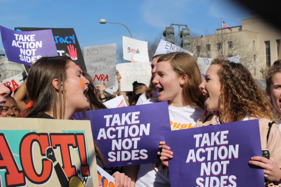 Juniors Darsey Trudo, Edie Lamantia and Ellie Lamantia shout during 2019s walkout against gun violence and march down Pennsylvania Avenue. Trudo was one of four juniors who planned the school’s participation in the walkout.