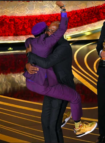 Spike Lee pounces on Samuel L. Jackson as he takes the stage to accept his award for Best Adapted Screenplay for his film BlacKkKlansman at the Dolby Theatre. Despite writing and directing many acclaimed films, this year marked Lee’s first Oscar win.