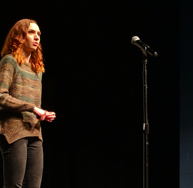 Hannah Dembosky performs the poem “Today” by Billy Collins. The showcase included dances, films and speeches from those involved in the fundraiser.