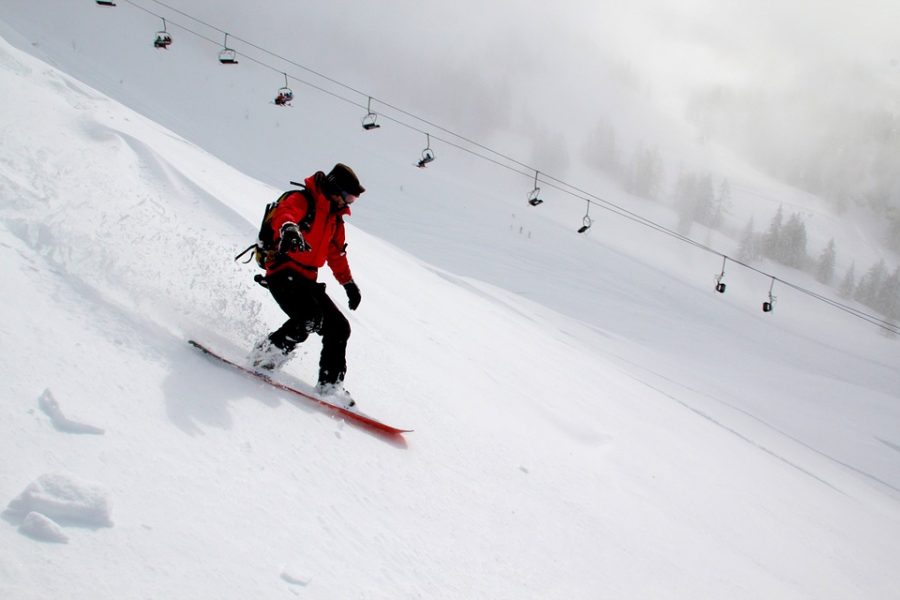 Students participate in snow sports during the cold winter months. Some students prefer snowboarding to skiing.