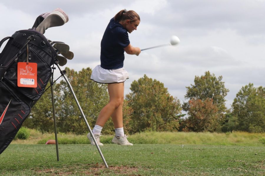 Sophomore Sophia Bandini swings her club during a tournament. The team attends multiple tournaments each season, where they are able to compete against golf teams from other schools. 