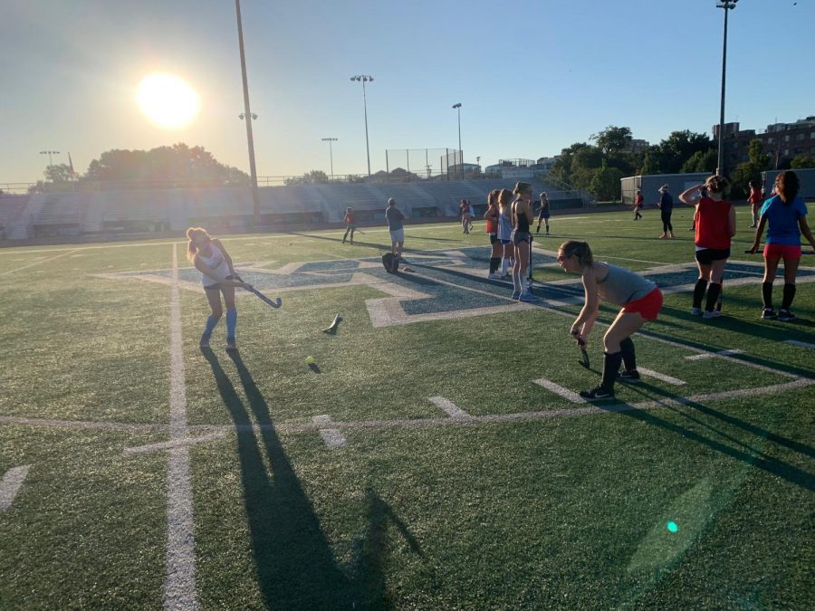 The varsity girls field hockey team prepared for the season by practicing over summer. Being on the team can be a large time commitment, even over summer, due to the amount of time that players spend practicing their skills. 