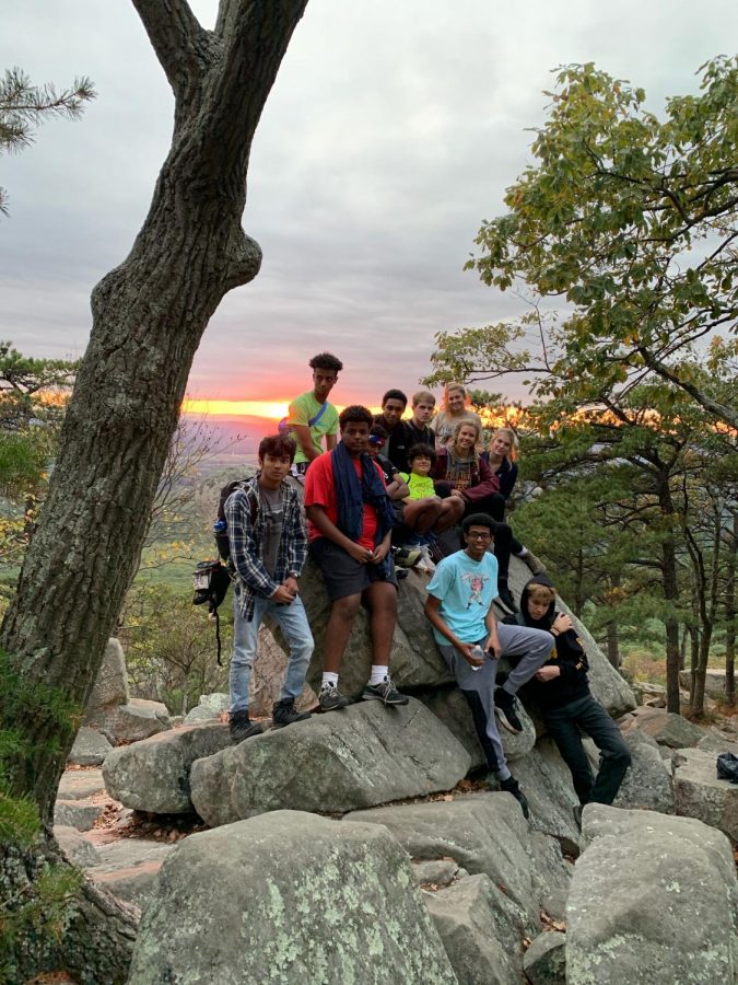 Outdoor Club members sit on a rock overlooking the Blue Ridge Mountains on Sugarloaf Mountain, Maryland. Hiking Sugarloaf was the clubs first outdoor activity.
