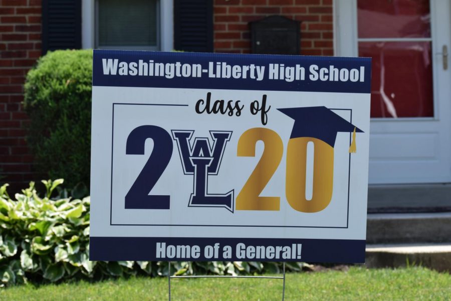 An Arlington family displays a yard sign to honor their senior. The plan to distribute the signs was devised by the administration after seeing the idea implemented for other schools in Arlington.