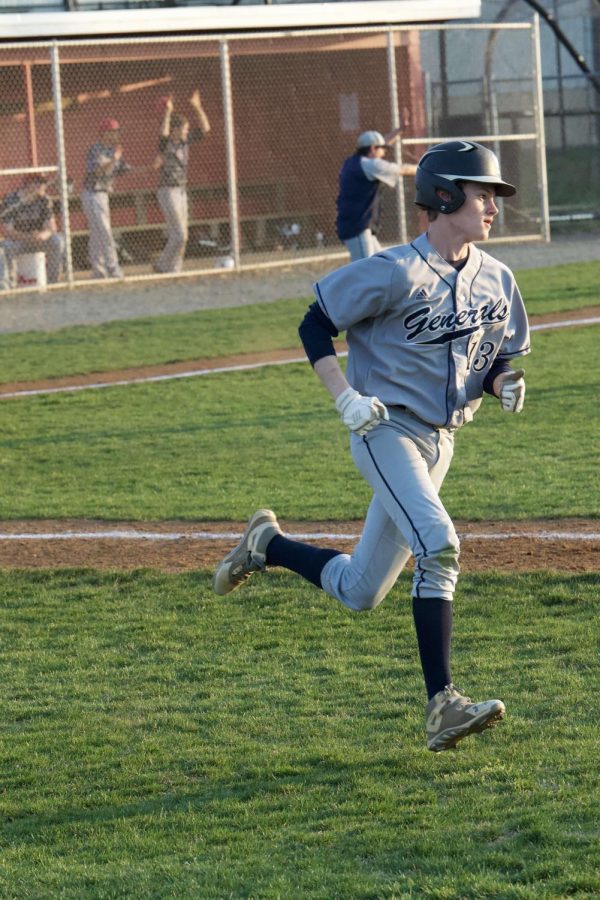 Andrew Bolfek, number 13, runs around the bases at lightning speed
