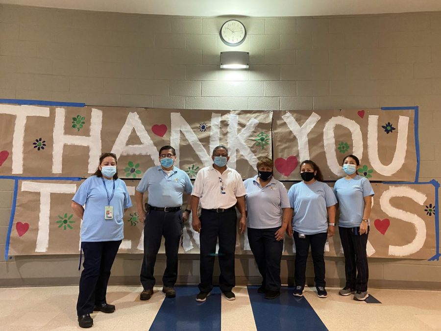 The custodial staff stands for a photo. They have been extremely helpful and necessary during this difficult time.